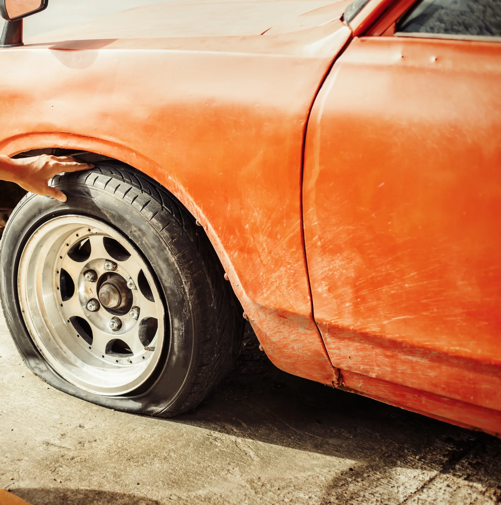 Roadside flat tire inspection before deciding the safest next step