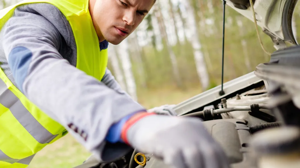 Technician assisting with a vehicle on the roadside